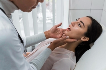 dentist examining patient from Sunland Park